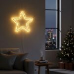 Χριστουγεννιάτικο αστέρι LED σε τοίχο με εορταστικό φωτισμό